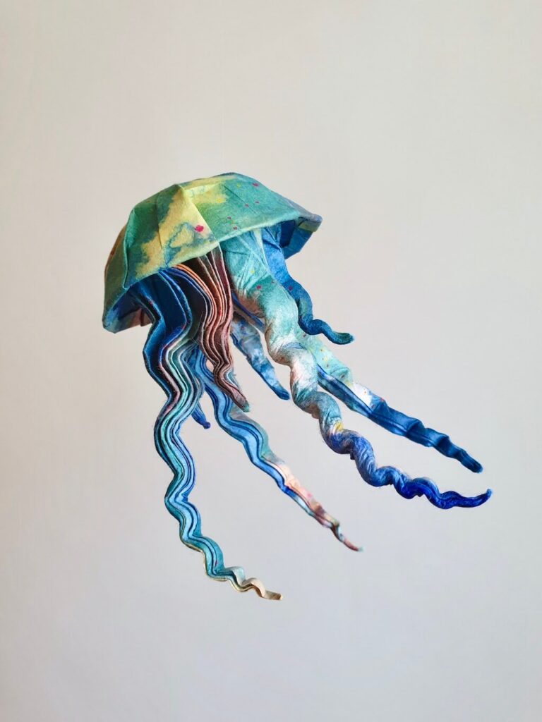 A colorful origami jellyfish folded from handmade Japanese paper