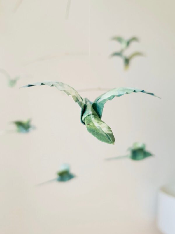 A hanging mobile with origami birds