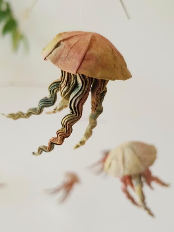 A hanging mobile with 7 origami jellyfish