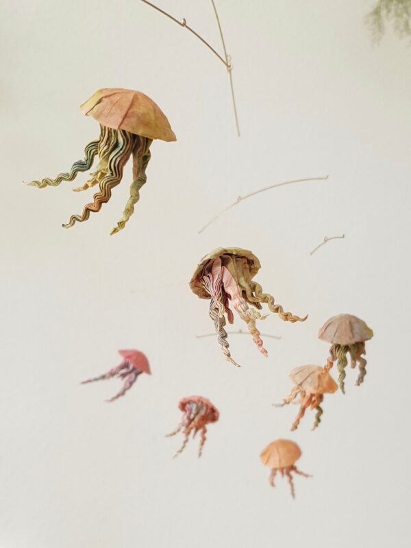 A hanging mobile with 7 origami jellyfish