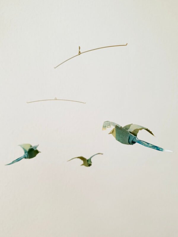 A simple hanging mobile with 3 green origami birds