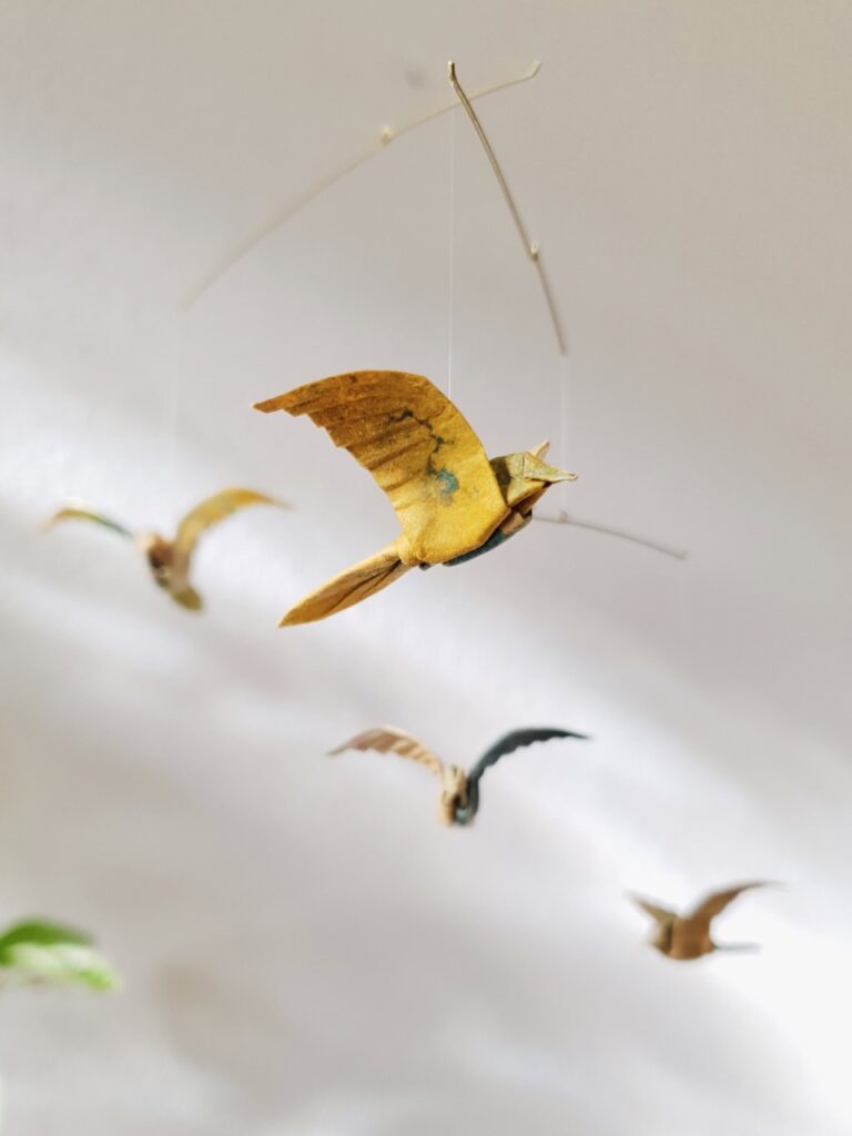A hanging mobile with fine origami birds