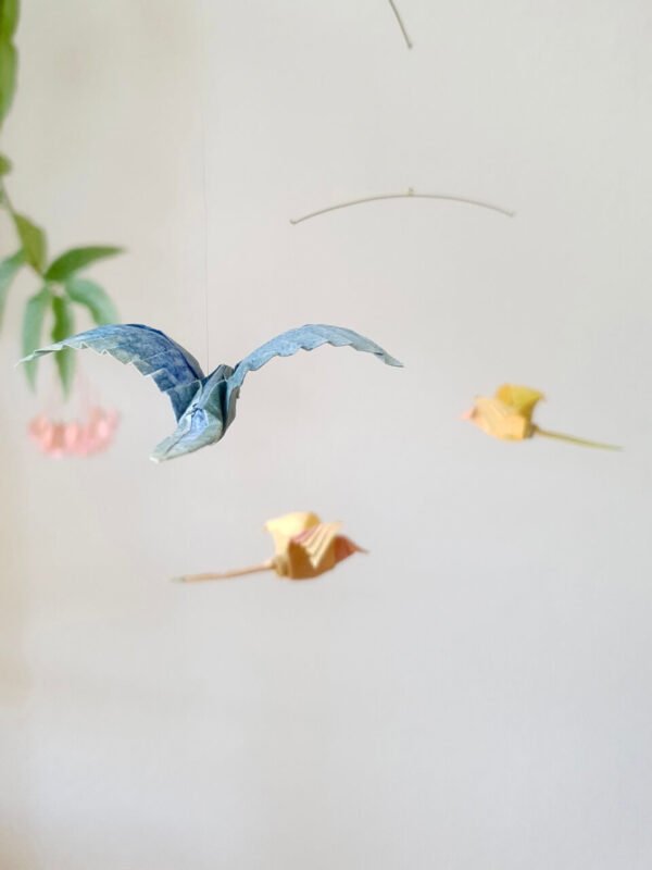 A simple hanging mobile with blue and yellow origami birds