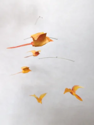A hanging mobile with 5 orange origami birds