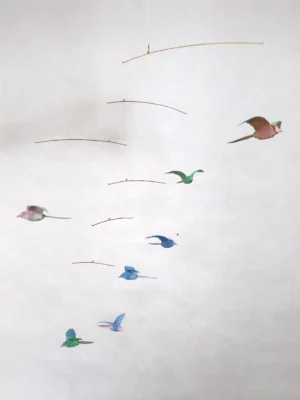 A hanging mobile with 7 origami bird in different colors