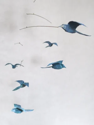 A hanging mobile with 6 blue origami birds
